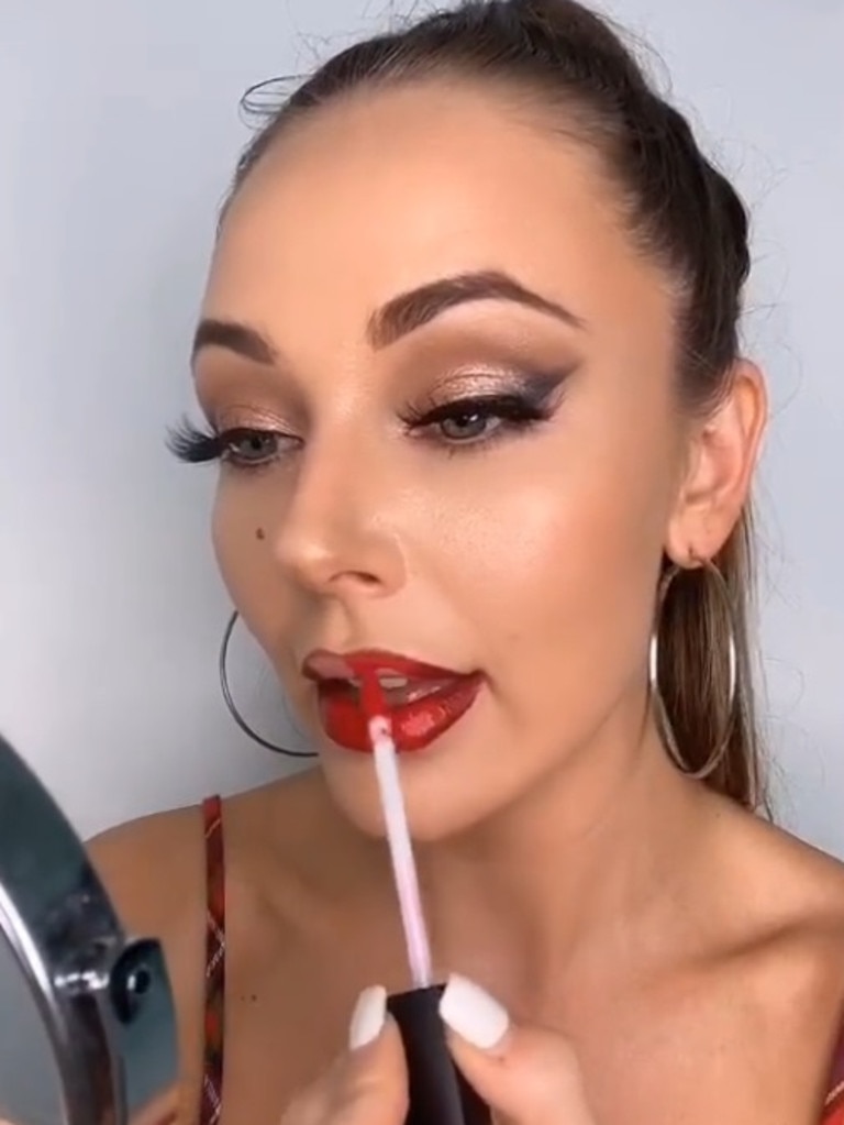 Dani showing how she applies the signature red lip. Picture: TikTok/danidboyy1