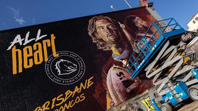 Artist Bastian Allfrey working on a Brisbane Broncos mural on Wickham st, Fortitude Valley. Photo: Zak Simmonds.