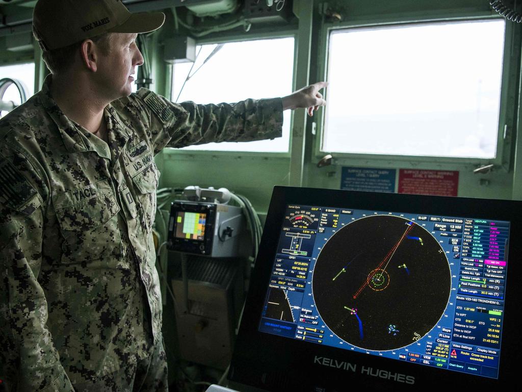 A member of staff of the NATO naval and marine monitors nearby vessels on the bridge of USS Mount Whitney during the NATO-led military exercise Trident Juncture. Picture: AFP