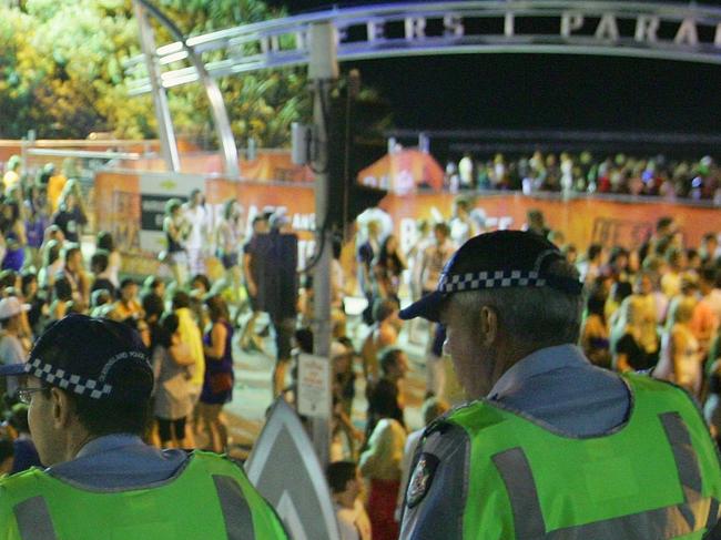 GOLD COAST, AUSTRALIA - NOVEMBER 23:  Police officers watch over the Schoolies week celebrations in Surfers Paradise on November 23, 2008 on the Gold Coast, Australia. Schoolies is the annual celebration by year 12 students following the culmination of their HSC exams. The celebrations happen in several official locations throughout Australia, but the Gold Coast kicks off the celebrations as the Queensland exams finish ahead of all other states.  (Photo by Sergio Dionisio/Getty Images)