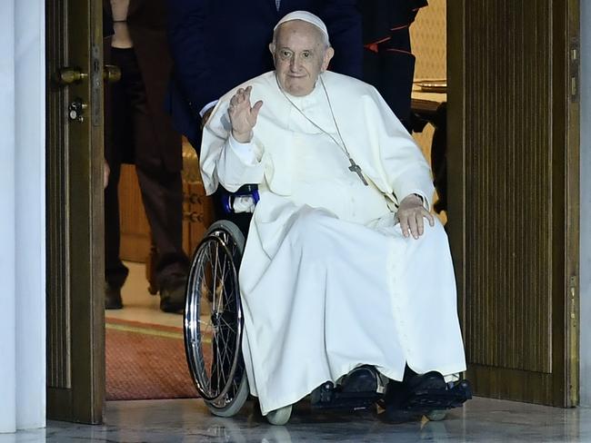 Pope Francis waves as he arrives for the Festival of Families at Paul-VI hall in The Vatican. Picture: AFP