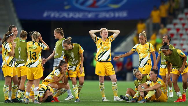 The Matildas console each other after losing the penalty shootout .