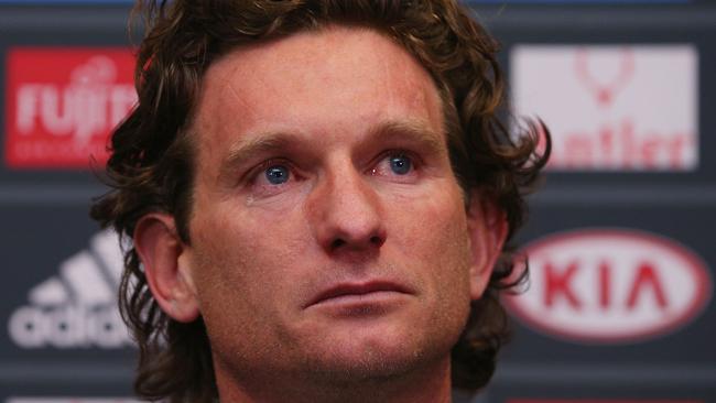 James Hird sheds tears as he announces his resignation as Essendon coach.