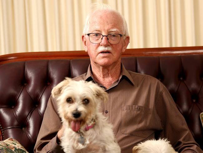 Mr Penhall with his dogs at home in Newport. Picture: Damian Shaw