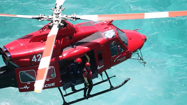 QPS, QFES and a local rescue helicopter are searching for a person after they fell from a boat near Townsville. Picture: Brendan Radke