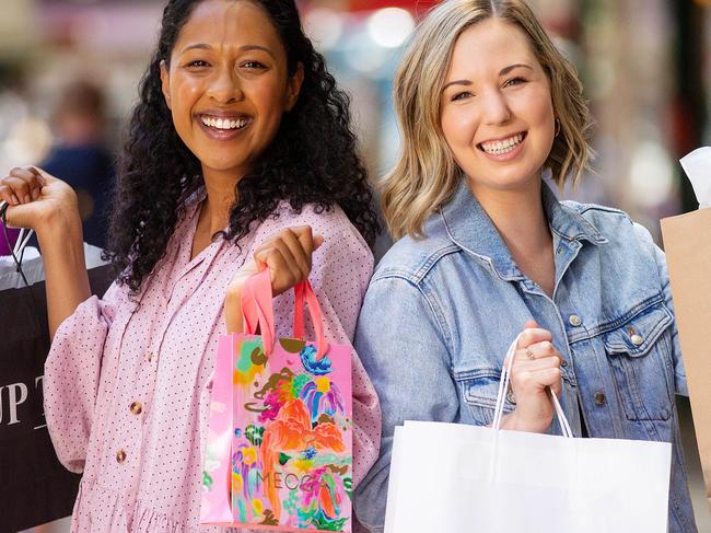 Christmas shoppers Chanelle Murray (pink dress), 27, and Kristyn DeZilwa (denim jacket), 27, are watching their Christmas spending in the remaining weeks before Christmas. Picture: Mark Stewart