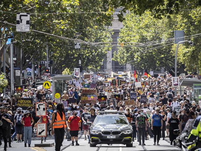 Invasion Day protest. Melbourne CBD. Australia Day. Protesters march through the CBD before rallying at Flinders Street Station. Picture: Jake Nowakowski