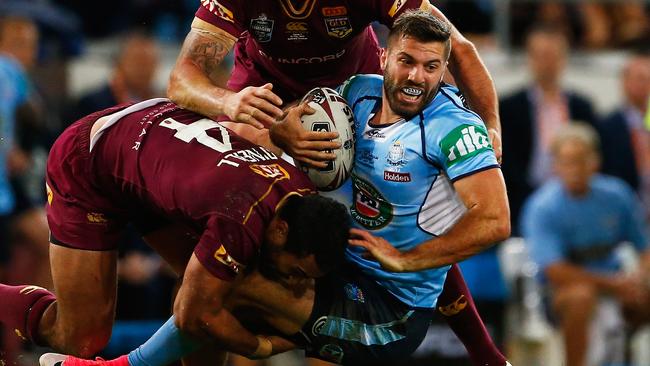 James Tedesco of the blues gets tackled.