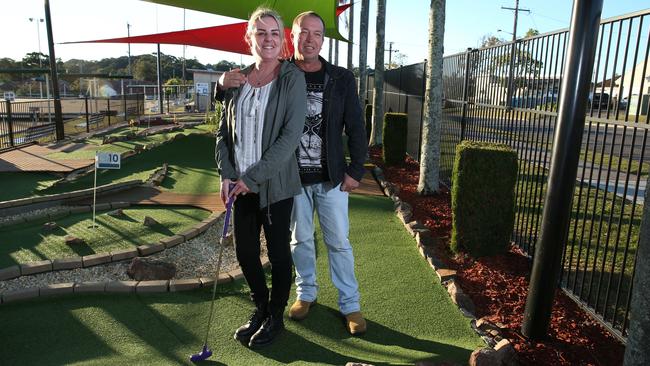 Local Newcastle couple Melinda Roberts and Craig Smolen playing mini golf at Kahibah Bowling Club. The mini golf course is a government funded project. Picture:  Britta Campion