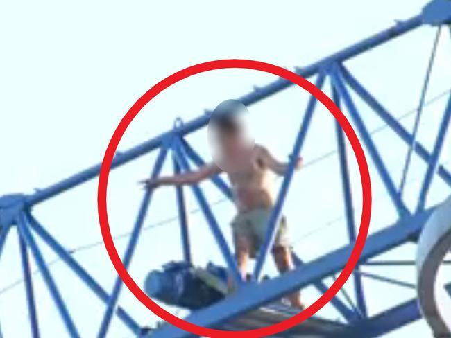 An at-times naked man refused to get down from a crane at a construction site in Melbourne’s north following a fire, sparking a more-than five-hour siege. Emergency services were called to a construction site on High St, Thomastown about 1.45am Friday after reports a fire had broken out. Picture: 9NEWS.