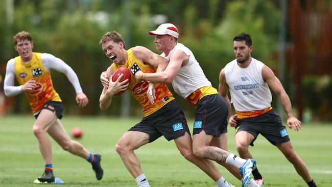 Bailey Humphrey (right) tackles Noah Anderson during the 2024 pre-season on the Gold Coast. Picture: Chris Hyde/Getty Images.