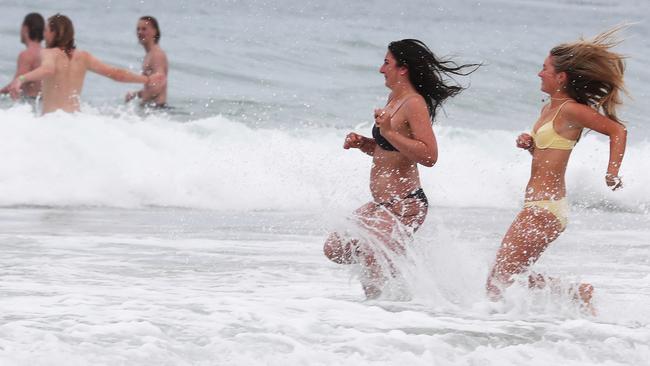 Schoolies hit the water at Clarkes Beach for the first weekend of festivities. Picture: Jason O'Brien