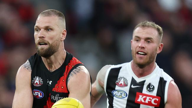 Collingwood coach Craig McRae has ruled out any attempt to recruit Essendon forward Jake Stringer (left). Picture: Mark Stewart