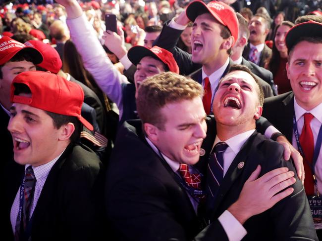 People cheer as voting results for Iowa come in at Republican presidential nominee Donald Trump's election night event in New York City in 2016. Picture: Getty