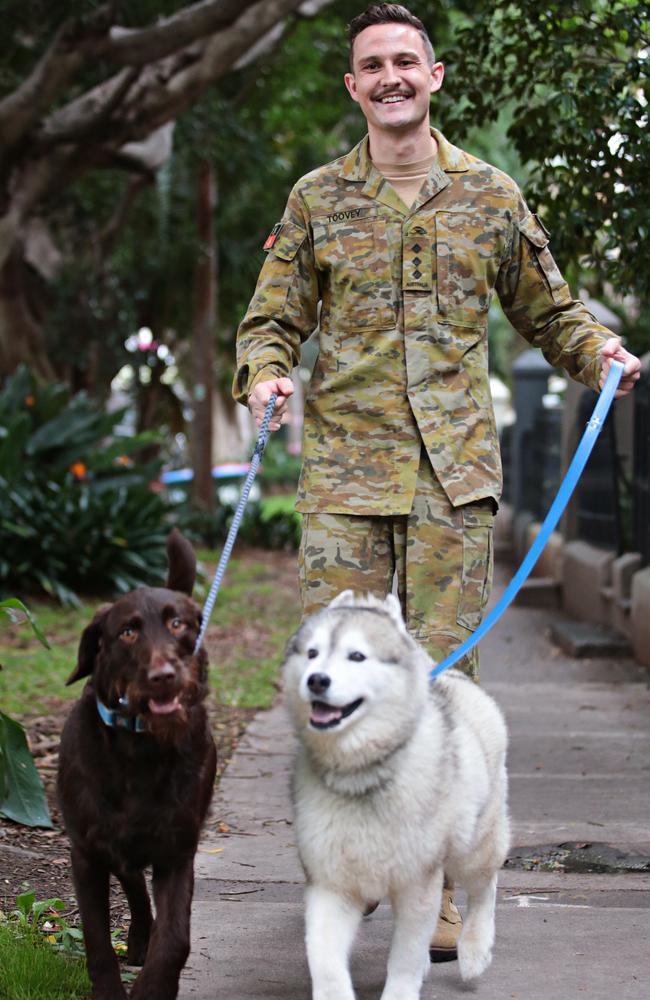 Australian Army major Hugo Toovey with his dogs Ernie and Iggy. Picture: Adam Yip