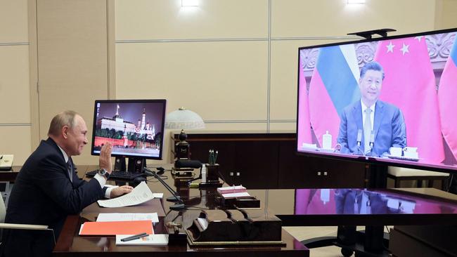 Vladimir Putin holds a meeting with Xi Jinping via a video link at the Novo-Ogaryovo state residence outside Moscow. Picture: AFP.