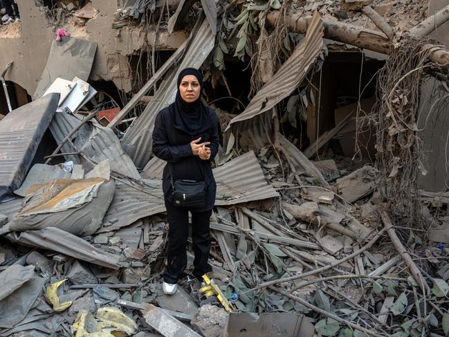 A woman stands in the rubble of the Israeli air strike on an apartment block in Beirut, Lebanon. Picture: Getty Images.