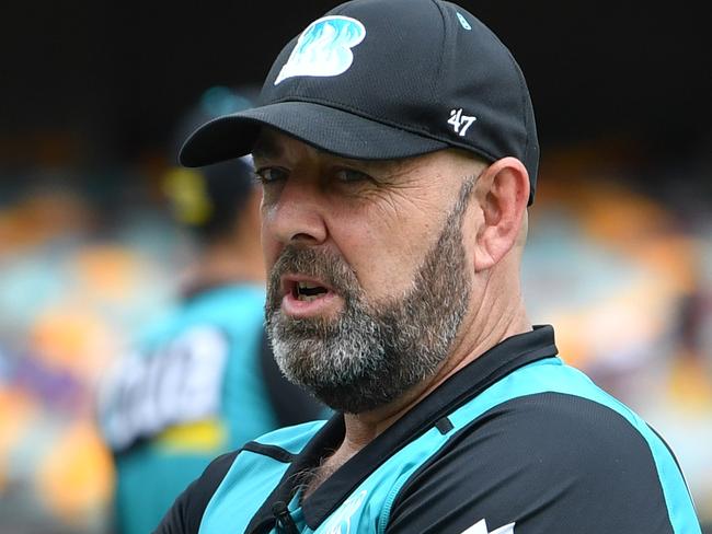 Chris Lynn (left) of the Heat is seen talking to Brisbane Heat coach Darren Lehmann (right) before the Big Bash League (BBL)cricket match between the Brisbane Heat and Adelaide Strikers at the Gabba in Brisbane, Tuesday, January 14, 2020. (AAP Image/Darren England) NO ARCHIVING, EDITORIAL USE ONLY, IMAGES TO BE USED FOR NEWS REPORTING PURPOSES ONLY, NO COMMERCIAL USE WHATSOEVER, NO USE IN BOOKS WITHOUT PRIOR WRITTEN CONSENT FROM AAP