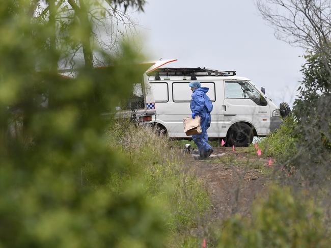 Forensic police at the scene south of Toowoomba. Picture: Kevin Farmer