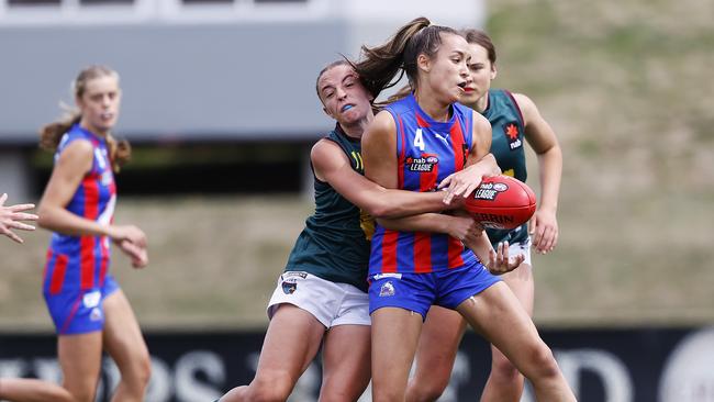 NAB League game between Tasmania Devils v Oakleigh Chargers from Kingston Twin Ovals. Devils Perri King Tackles Chargers Alexandra McCulloch. Picture: Zak Simmonds