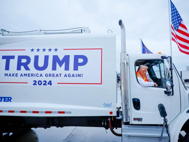 GREEN BAY, WISCONSIN - OCTOBER 30: Republican presidential nominee, former President Donald Trump holds a press conference from inside trash hauler at Green Bay Austin Straubel International Airport on October 30, 2024 in Green Bay, Wisconsin. With less than a week until Election Day, Trump is campaigning for re-election in the battleground states of North Carolina and Wisconsin.   Chip Somodevilla/Getty Images/AFP (Photo by CHIP SOMODEVILLA / GETTY IMAGES NORTH AMERICA / Getty Images via AFP)