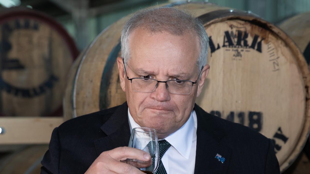 Mr Morrison samples a whisky. Picture: Jason Edwards