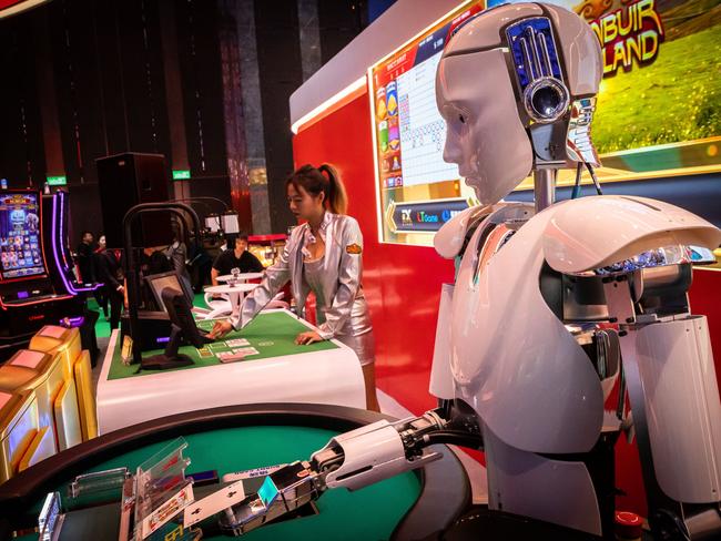 A robot croupier deals playing cards at the Macau Gaming Show in China. Picture: Eduardo Leal/Bloomberg via Getty Images