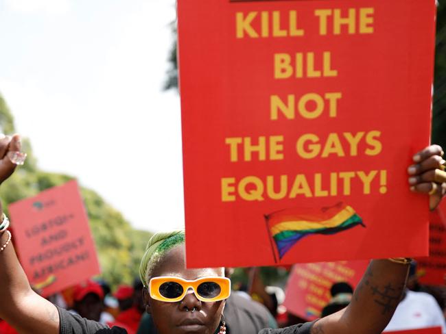 In this file photo taken on April 04, 2023 Ugandaâs queer activist Papa De raises her fist outside the Uganda High Commission in Pretoria during a picket against the countryâs anti-homosexuality bill. Ugandan LGBTQ rights defender, artist and photographer DeLovie Kwagala, also known as Papa De, who for South Africa amid Uganda draconian anti-gay legislation, will be forced to return to their country. Uganda's parliament early this month passed a new draft of anti-gay legislation, retaining many draconian provisions despite President Yoweri Museveni's call to rework an earlier version of the bill following an outcry from Western governments and rights groups. The bill will now be sent to Museveni, who can again choose to use his veto or sign it into law. Homosexuality was criminalised in Uganda under colonial laws, but there has never been a conviction for consensual same-sex activity since independence from Britain in 1962. (Photo by Phill Magakoe / AFP)