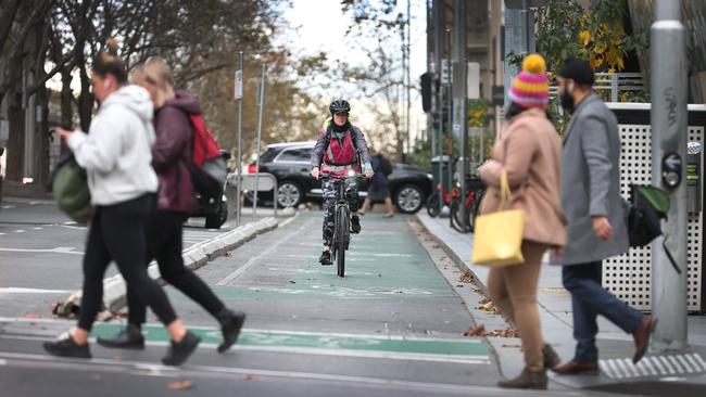 A cyclist makes use of the Exhibition St bike lane. Picture: David Caird