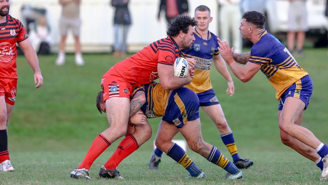 Matt Crocker hitting the Mullum defence. Picture: DC Sports Photography