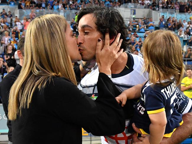 Johnathan Thurston of the Cowboys is seen kissing his wife Samantha as he runs onto the field before playing his final NRL game during the Round 25 NRL match between the Gold Coast Titans and the North Queensland Cowboys at Cbus Super Stadium on the Gold Coast, Saturday, September 1, 2018. (AAP Image/Darren England) NO ARCHIVING, EDITORIAL USE ONLY