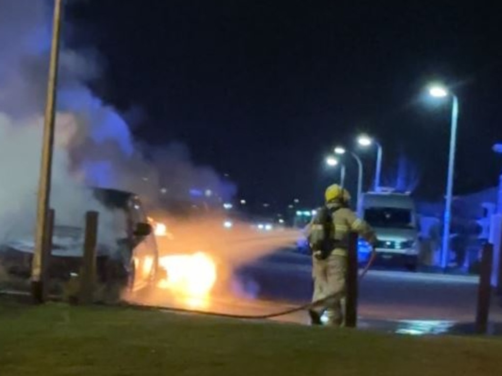 Firefighters extinguish the car fires, which were started by Tsai-Wei Hung. Picture: Supplied