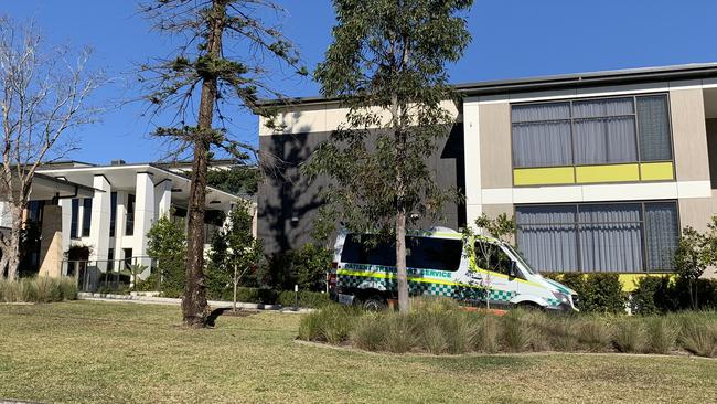 A patient transport service vehicle arrives at the home shortly before 1pm on Monday