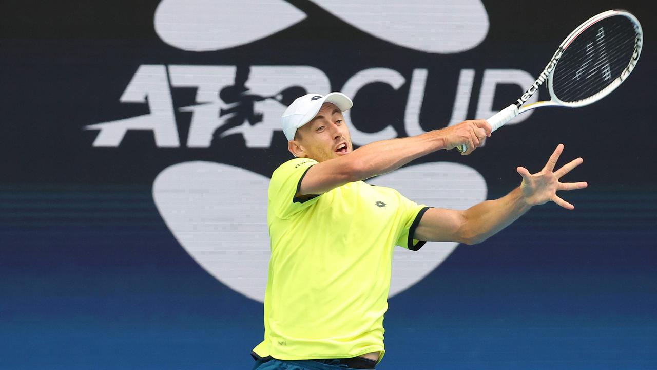 John Millman hits a return against Spain's Pablo Carreno Busta.