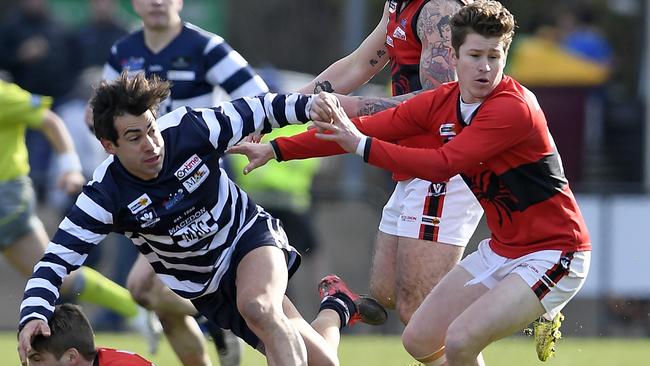 Macedon’s Daniel Trajanovski and Romsey’s Aaron Paterson. Picture: Andy Brownbill