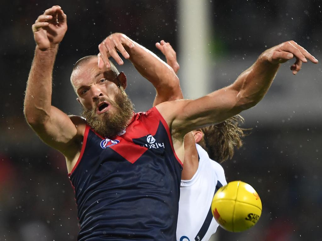 Max Gawn of the Demons (left) and Rhys Stanley of the Cats contest during the Round 2 AFL match between the Geelong Cats and the Melbourne Demons at GMHBA Stadium in Geelong, Saturday, March 30, 2019. (AAP Image/Julian Smith) NO ARCHIVING, EDITORIAL USE ONLY