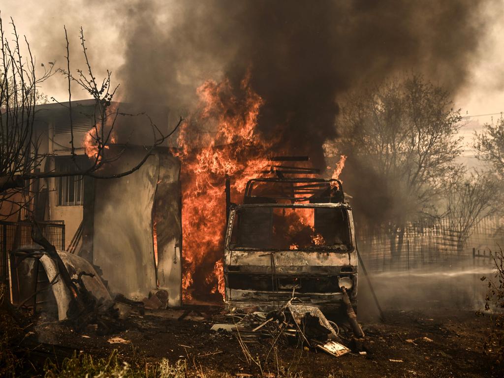 Greek firefighters have struggled to contain uncontrolled fires throughout the country for six days. Picture: Angelos Tzortzinis / AFP