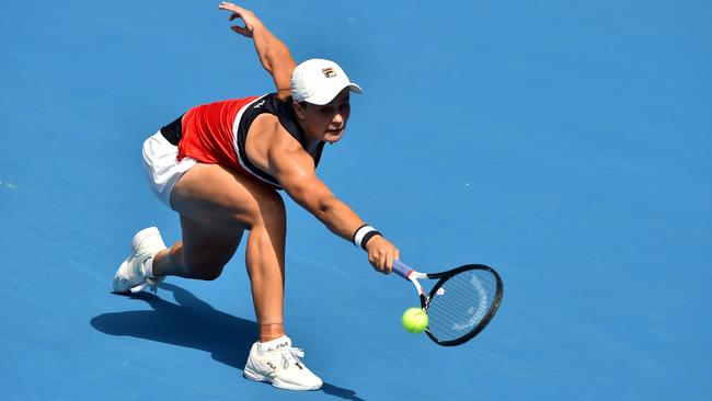 Ash Barty at full stretch against Halep. Picture: AFP