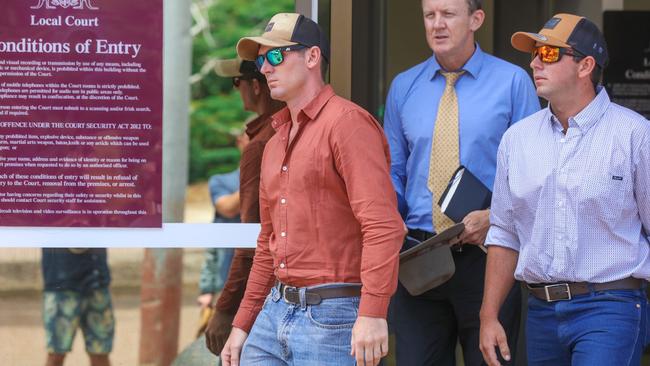 Benjamin Wright and Jayden Harmes with defence lawyer Peter Maley outside the Darwin Local Court on Friday. Picture: Glenn Campbell