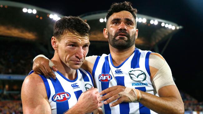 Brent Harvey and Lindsay Thomas in tears after Boomer’s final game. Picture: Getty Images