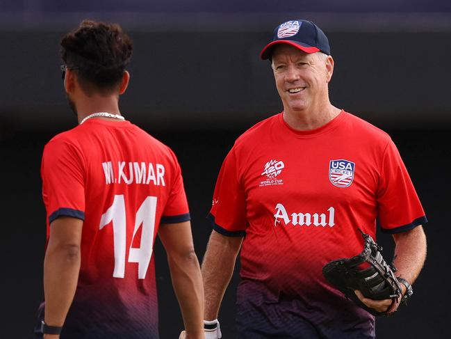 DALLAS, TEXAS - JUNE 01: Stuart Law, Head Coach of USA chats with his player Milind Kumar prior to the ICC Men's T20 Cricket World Cup West Indies & USA 2024 match between USA and Canada at Grand Prairie Cricket Stadium on June 01, 2024 in Dallas, Texas.   Robert Cianflone/Getty Images/AFP (Photo by ROBERT CIANFLONE / GETTY IMAGES NORTH AMERICA / Getty Images via AFP)