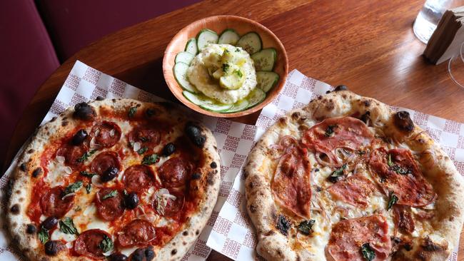 Franc Jrs have opened their second Gold Coast venue at Nobby's Beach .Co owner and chef Carlos Lara with some of their delicious Pizza. Picture Glenn Hampson