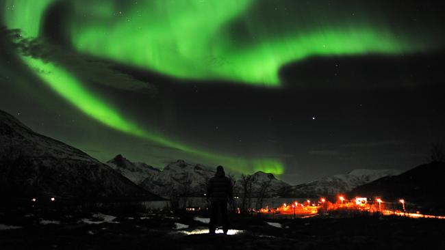 The Aurora Borealis, or Northern Lights, near the city of Tromsoe, northern Norway, in 2012. Stargazers were out in force in northern Europe, hoping to be awed by a spectacular showing of northern lights after the most powerful solar storm in six years.