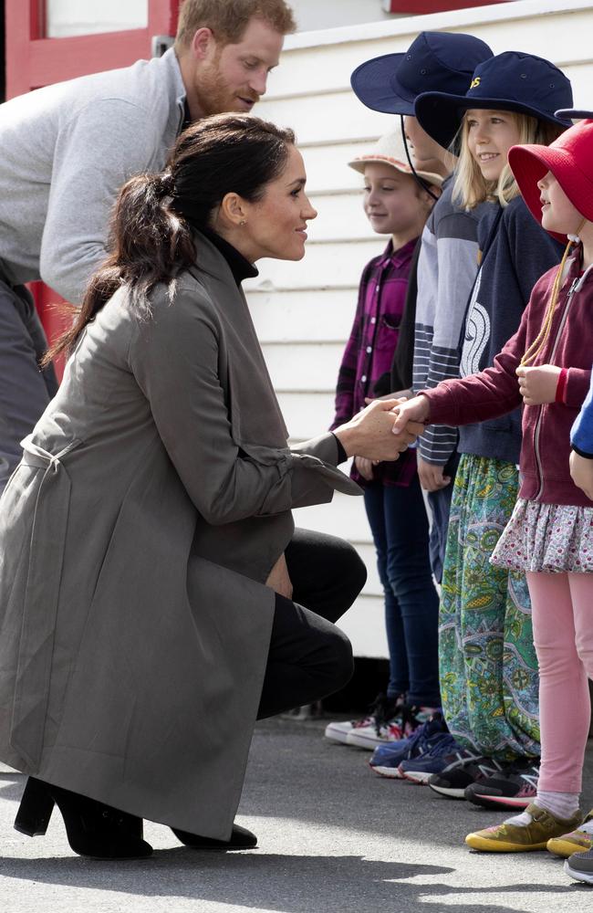 Britain's Prince Harry and Meghan, Duchess of Sussex talk with children following a meeting with young people from a number of mental health projects operating in New Zealand. Picture: AP