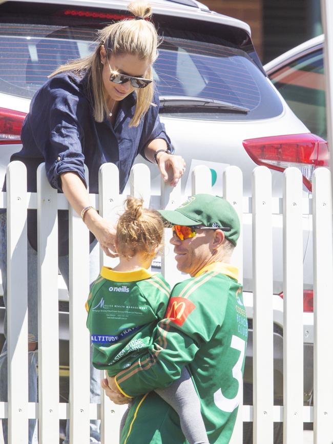 Warner talks to wife Candice and kids after getting out for 13. Picture: Jenny Evans