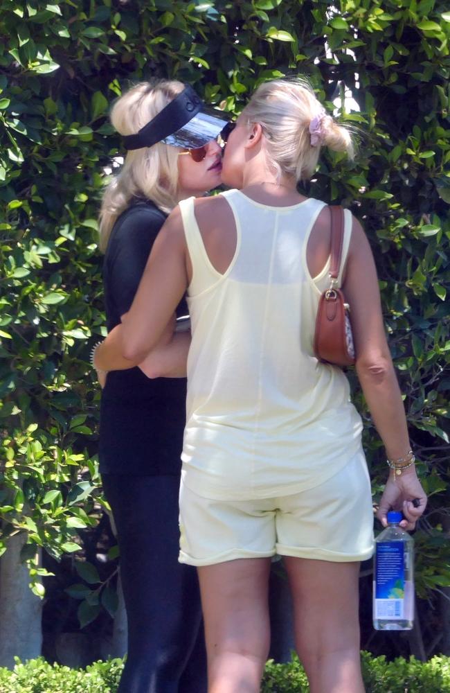 Rebel Wilson (left) and Ramona share a kiss. Picture: Backgrid