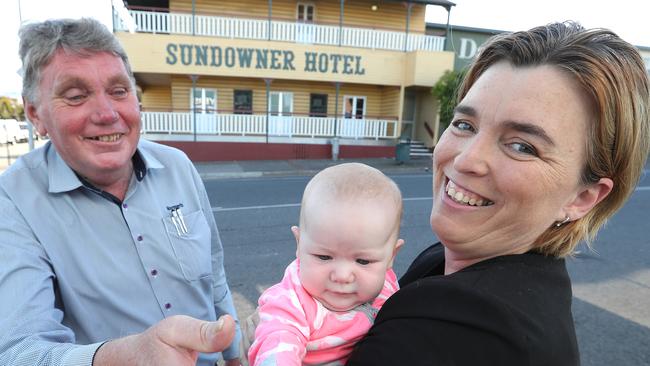 ALP candidate Melissa McMahon with three-month-old baby Mackenzie meets real estate agent Brian Reynolds in Beenleigh, south of Brisbane. Picture: Lyndon Mechielsen