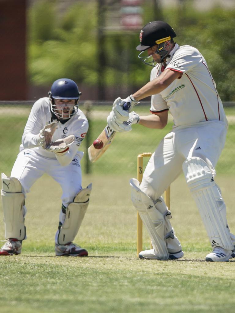 CSB - Carnegie keeper David Morrissey watches on as Caulfield South batsman Bradley Erasmus cuts. Picture: Valeriu. Campan