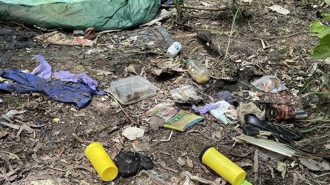 Needles and sharps containers are strewn around the 20sq m area, with bedding and discarded clothes suggesting it is an area frequented by intravenous drug users.