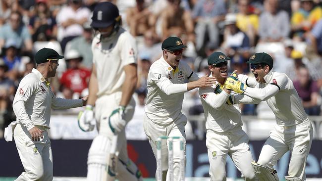 Australian players celebrate the wicket of Jos Buttler. Picture: Getty Images